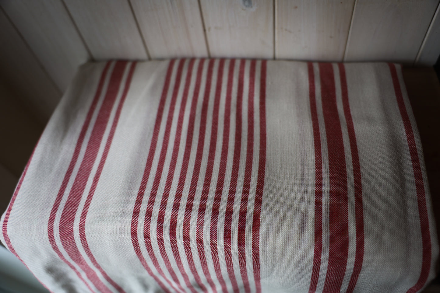 Off-white and red stripped tablecloth
