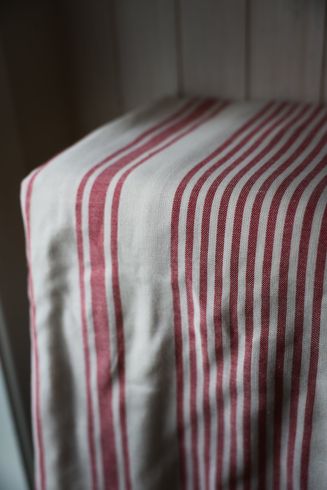 Off-white and red stripped tablecloth